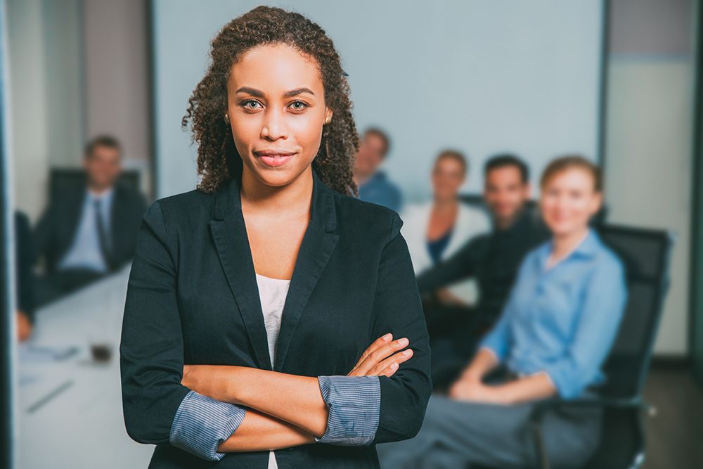 Confident woman leader in board room