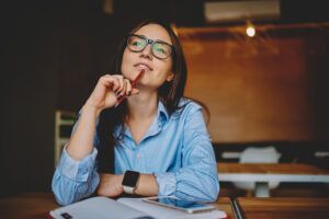 Woman setting goals at desk