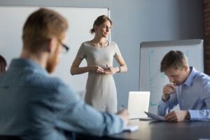 Woman giving a presentation in meeting room