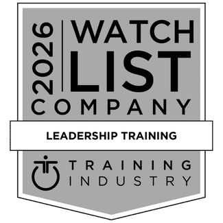 Award badge showing The New Standard named 2026 leadership training company to watch by Training Industry